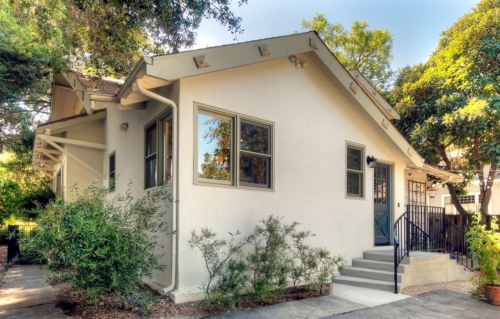 Medium sized and white classic bungalow render house exterior in San Francisco with a pitched roof.