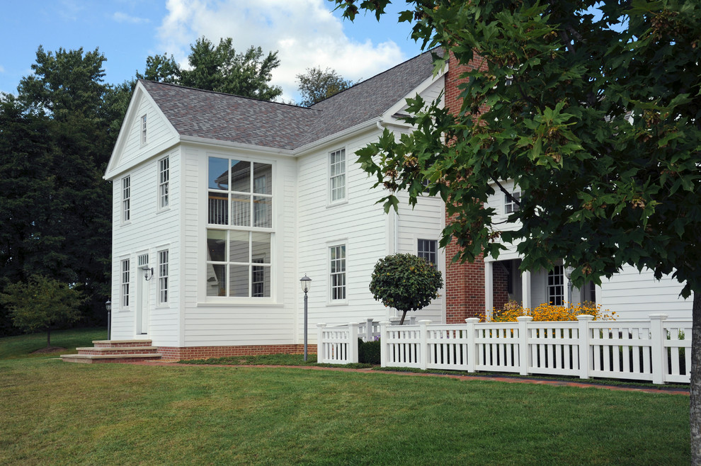 Mid-sized cottage white three-story wood gable roof idea in Columbus