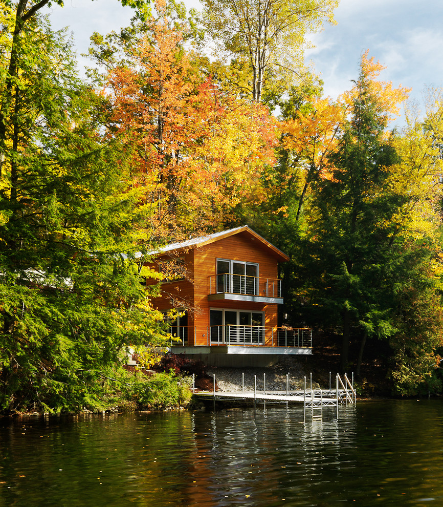 Inspiration for a contemporary wood exterior home remodel in Burlington
