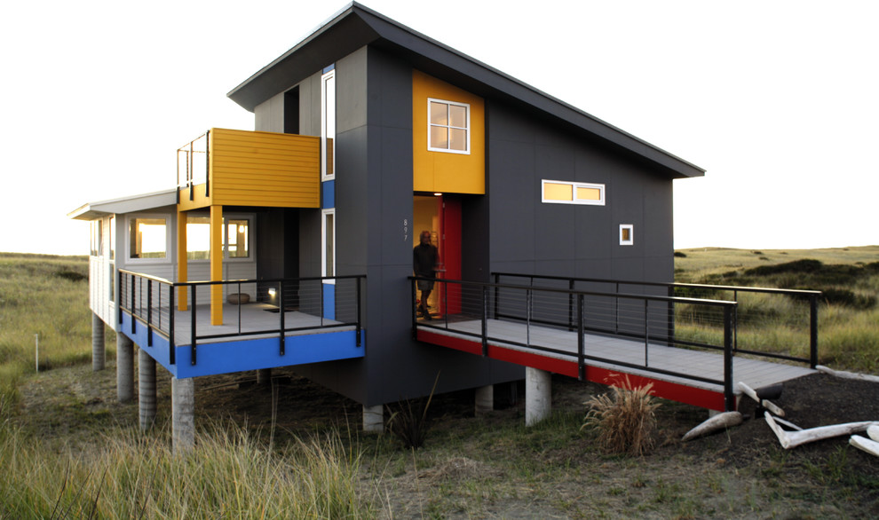 Inspiration for a small contemporary one-story exterior home remodel in Seattle with a shed roof