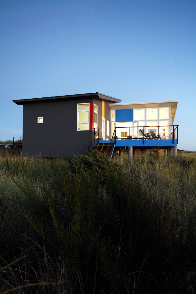 Photo of a small contemporary bungalow house exterior in Seattle with a lean-to roof.