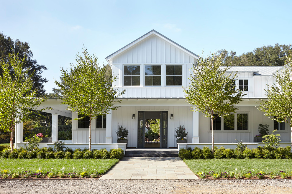 Example of a large trendy white two-story wood gable roof design in San Francisco