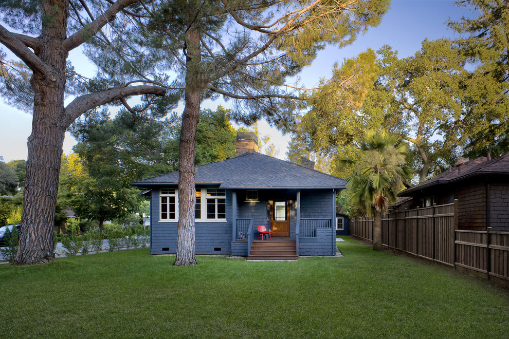 This is an example of a small traditional bungalow house exterior in San Francisco with wood cladding and a hip roof.