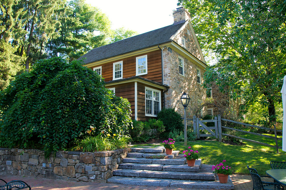 Inspiration for a traditional house exterior in Philadelphia with stone cladding.