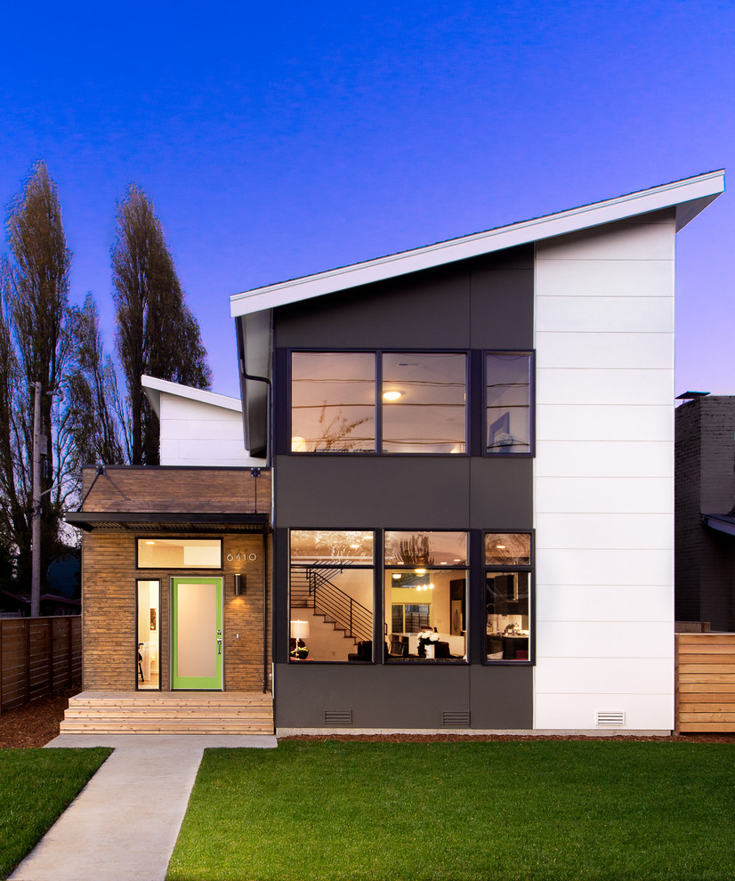 Inspiration for a contemporary two floor house exterior in Seattle with a lean-to roof.