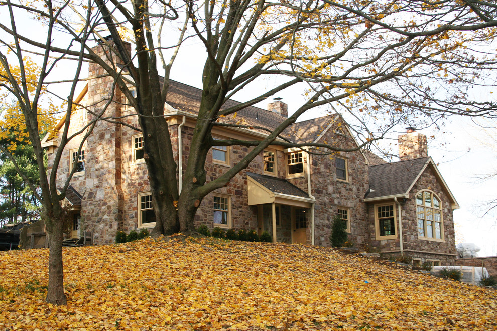 Inspiration for a traditional house exterior in Philadelphia with stone cladding.