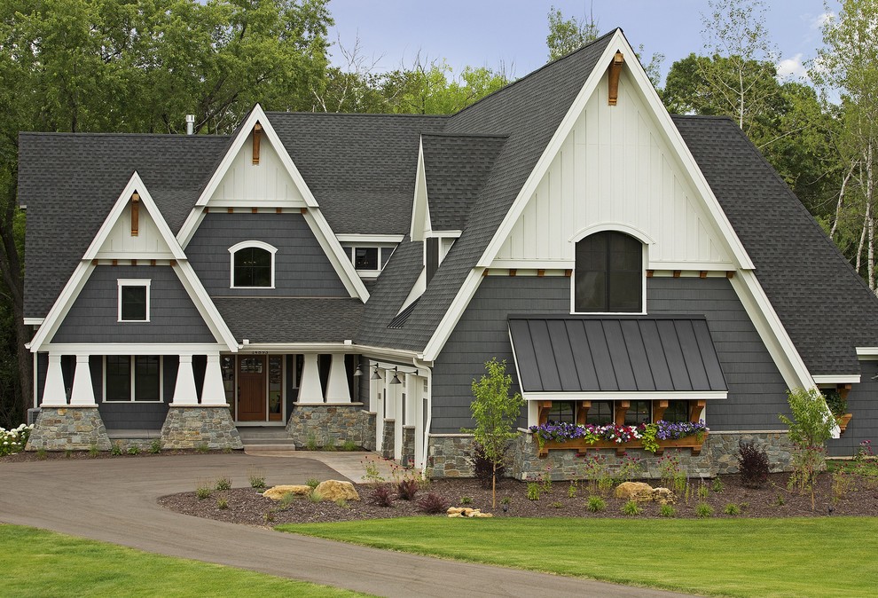 Inspiration for a mid-sized craftsman gray two-story mixed siding gable roof remodel in Minneapolis
