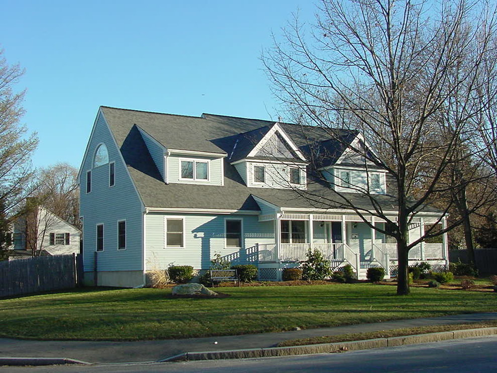 Mid-sized elegant blue two-story vinyl exterior home photo in Boston with a shingle roof
