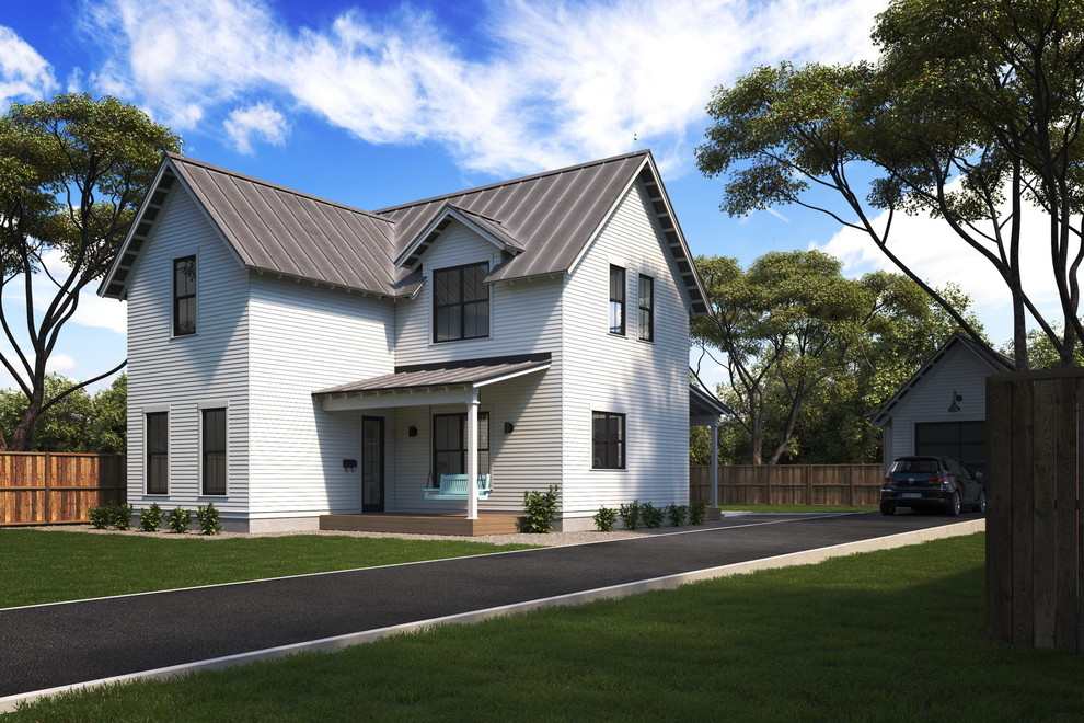 Cette photo montre une petite façade de maison blanche nature à un étage avec un revêtement en vinyle, un toit à deux pans et un toit en métal.