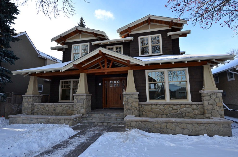 Inspiration for a timeless brown two-story mixed siding exterior home remodel in Calgary