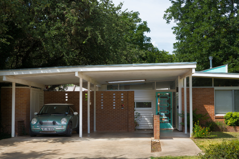 1960s one-story brick exterior home photo in Austin