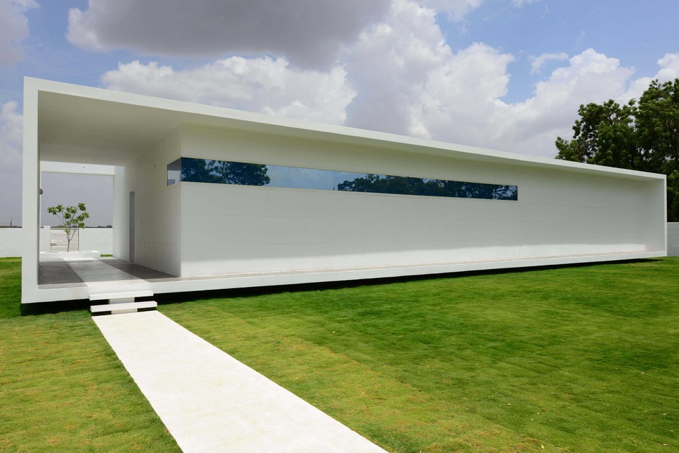 Inspiration för stora moderna vita hus, med allt i ett plan och platt tak