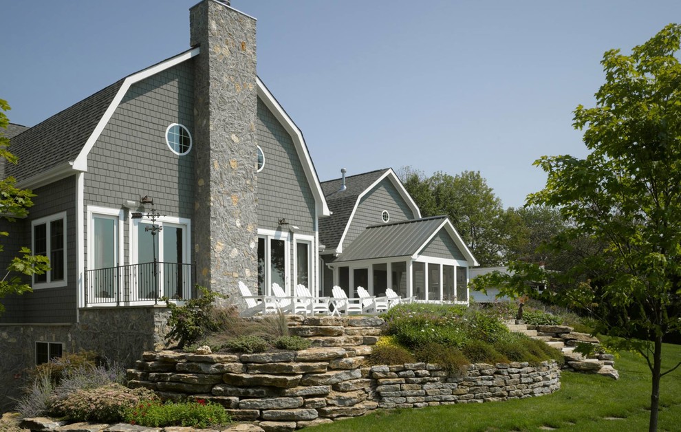 Example of a large farmhouse gray two-story exterior home design in Houston