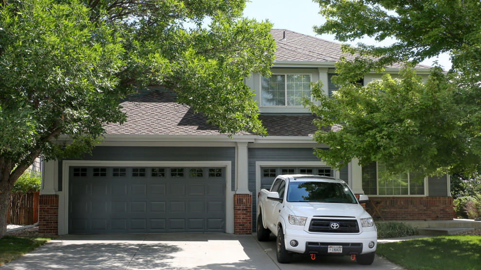 This is an example of a large traditional garage in Denver.
