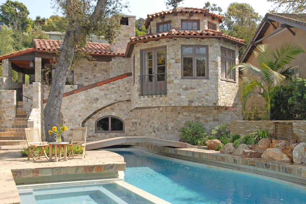 Mediterranean house exterior in Los Angeles with stone cladding.