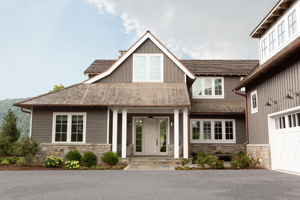 This is an example of a medium sized farmhouse two floor house exterior in New York.