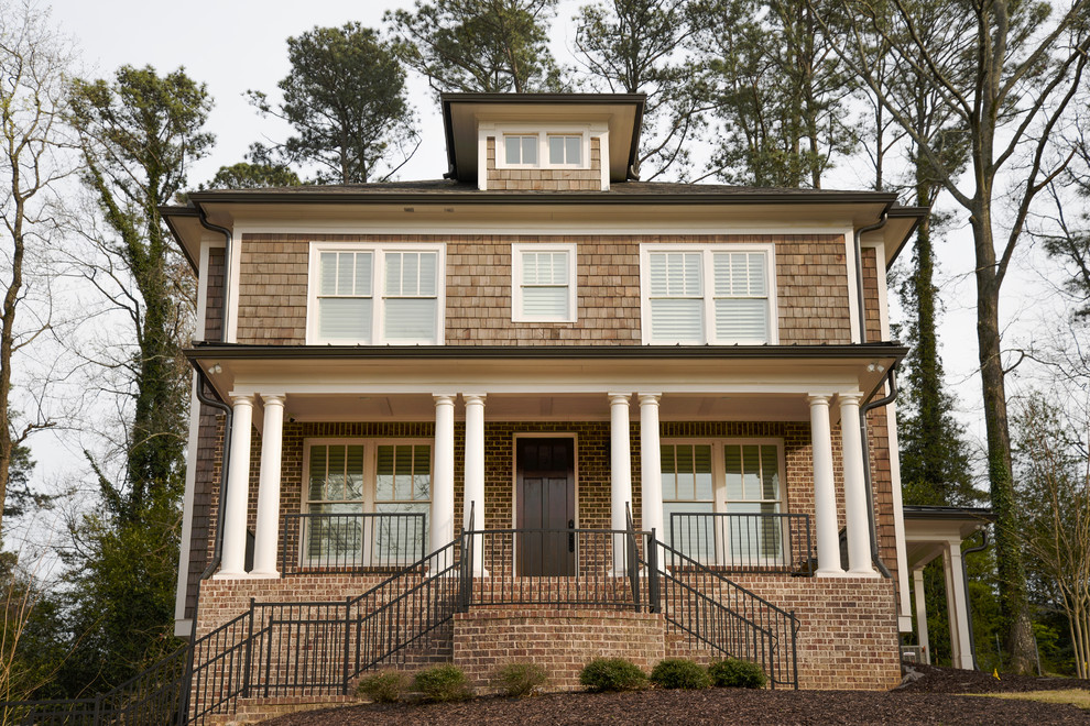 Photo of a large and brown traditional two floor detached house in Atlanta with mixed cladding, a hip roof and a mixed material roof.
