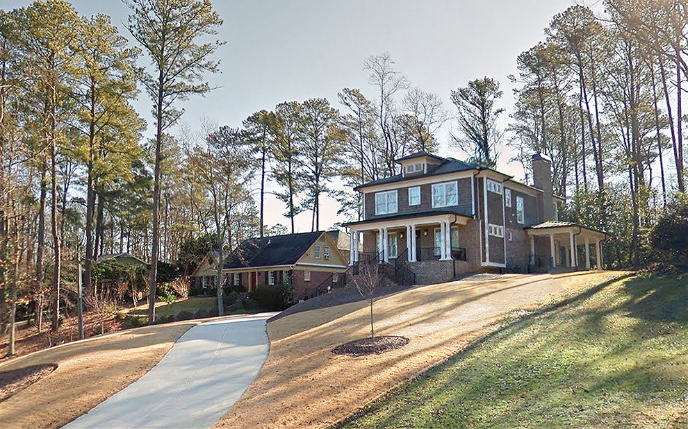 Inspiration for a large timeless brown three-story wood exterior home remodel in Jacksonville