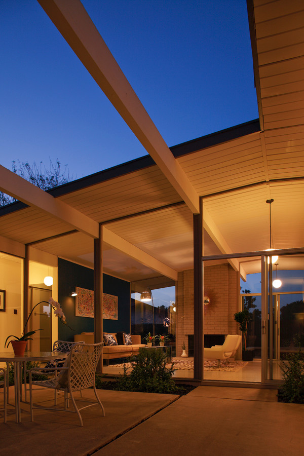 This is an example of a large retro bungalow house exterior in Orange County.
