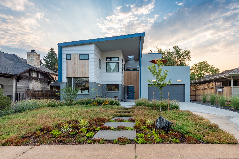 Trendy gray two-story mixed siding house exterior photo in Denver with a shed roof
