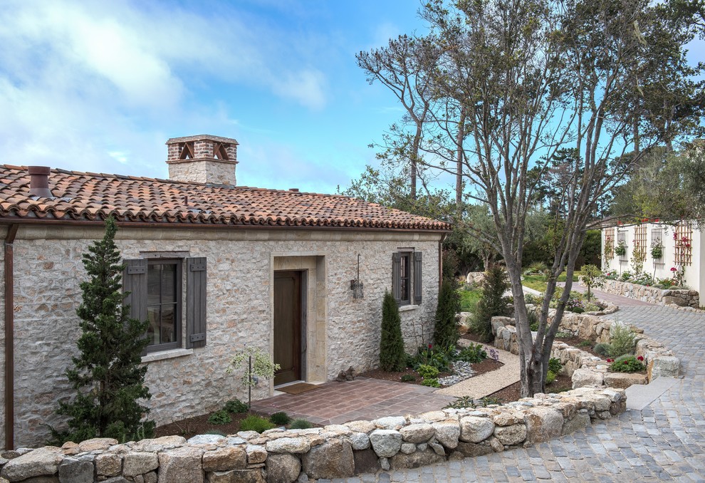 Mediterranean one-story stone gable roof idea in San Francisco