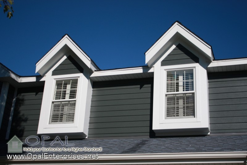 Example of a mid-sized classic gray two-story concrete fiberboard exterior home design in Chicago