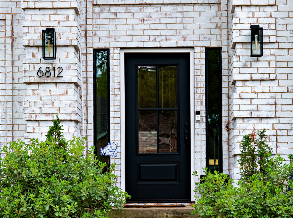 Large and white traditional two floor brick detached house in Dallas with a shingle roof.