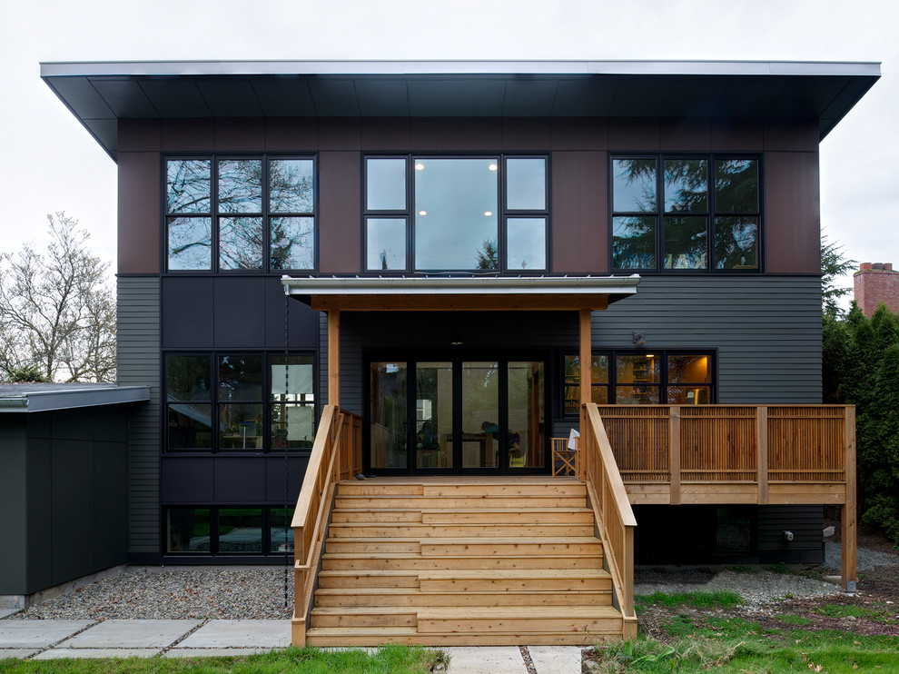 Medium sized contemporary two floor house exterior in Seattle with concrete fibreboard cladding.