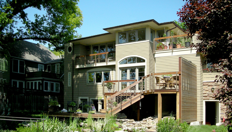 Example of a mid-sized classic two-story wood exterior home design in Kansas City