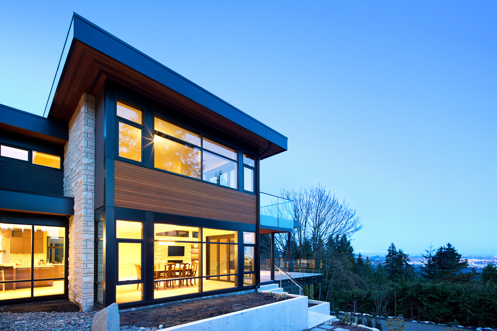 Inspiration for a contemporary house exterior in Vancouver with three floors.