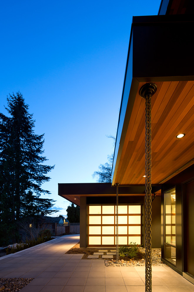Inspiration for a contemporary three-story exterior home remodel in Vancouver
