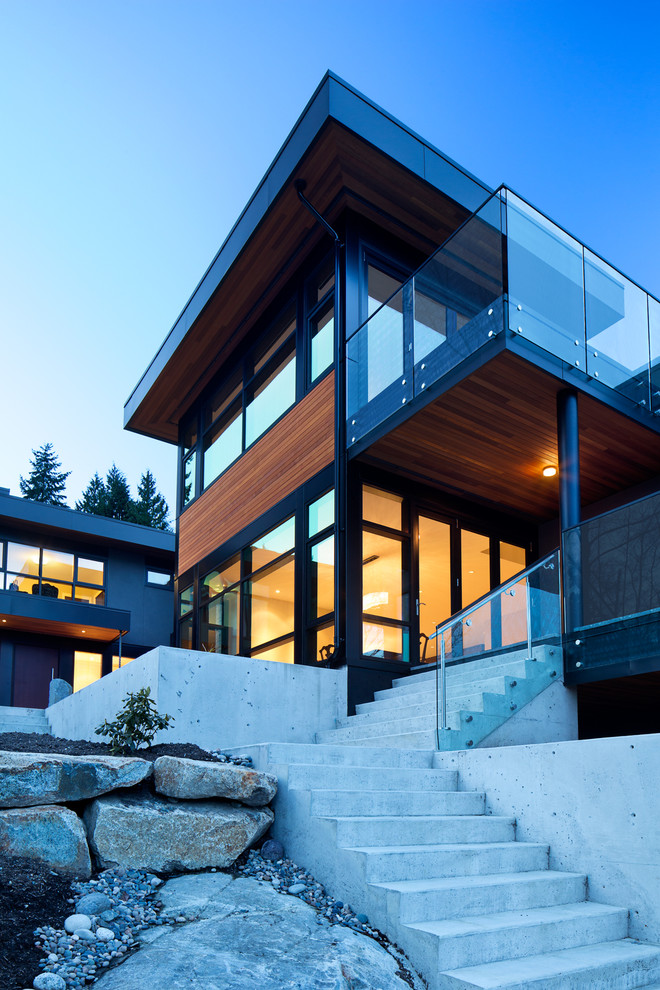 Example of a trendy three-story exterior home design in Vancouver