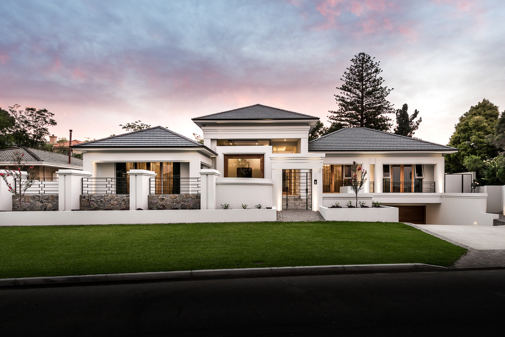 Inspiration for an expansive and beige contemporary bungalow house exterior in Perth with a pitched roof.