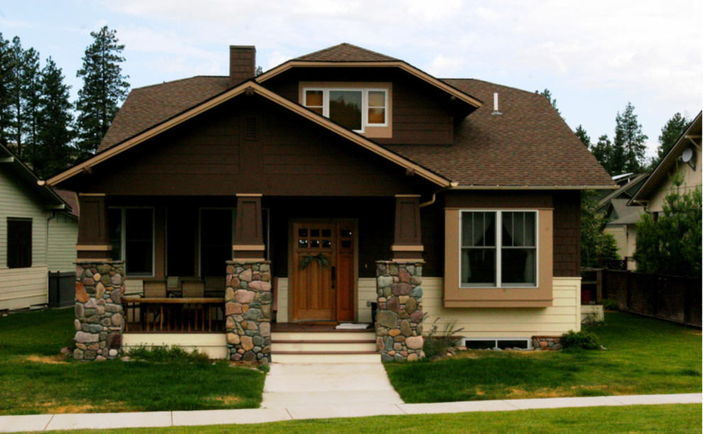 Example of a trendy brown two-story mixed siding exterior home design in Other