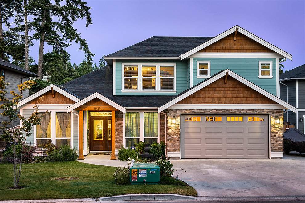 Craftsman green one-story mixed siding exterior home idea in Vancouver