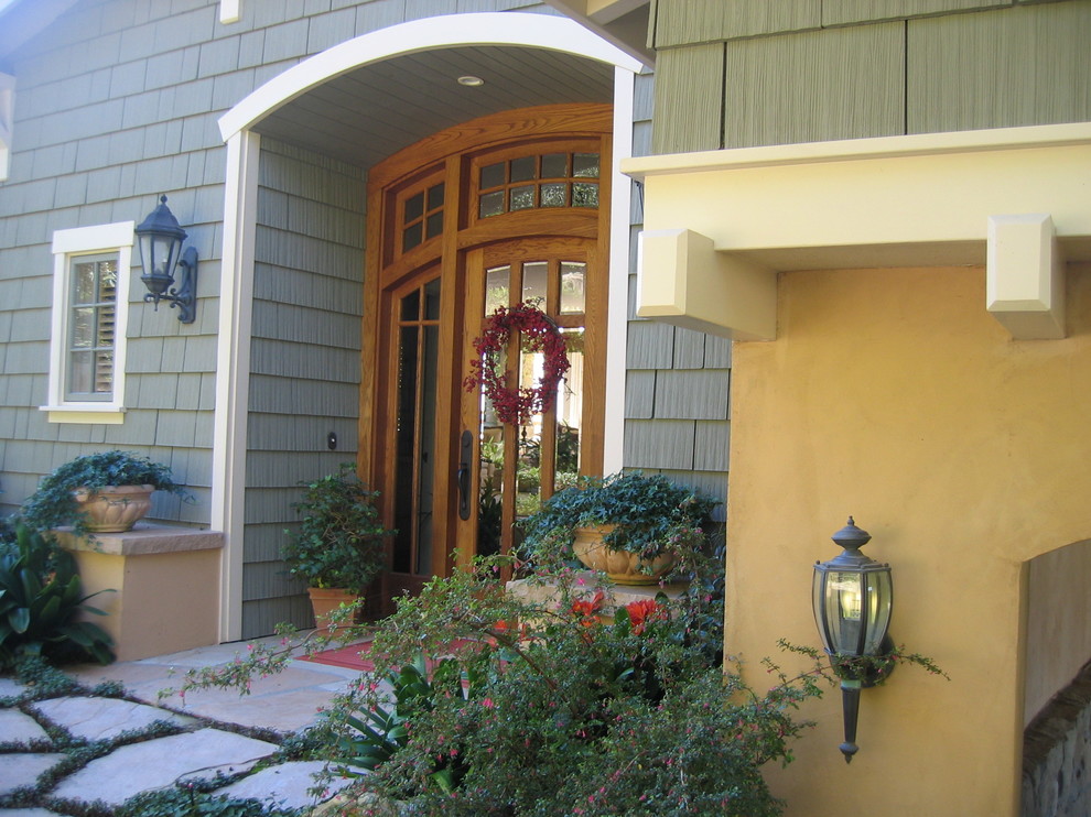 Inspiration for a craftsman green two-story mixed siding exterior home remodel in Santa Barbara