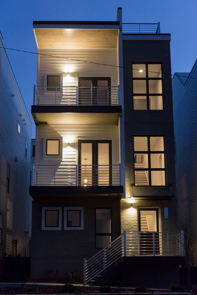 Example of a trendy three-story concrete fiberboard townhouse exterior design in Nashville