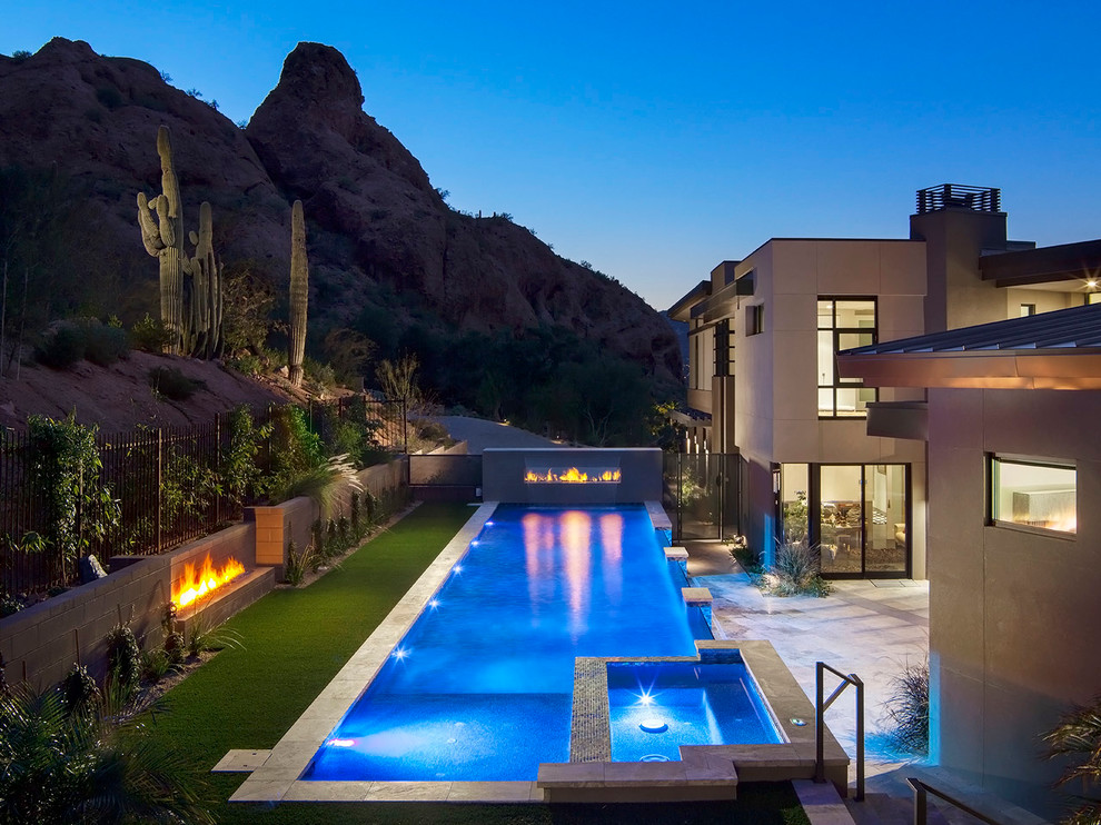 Design ideas for a large contemporary swimming pool in Phoenix.