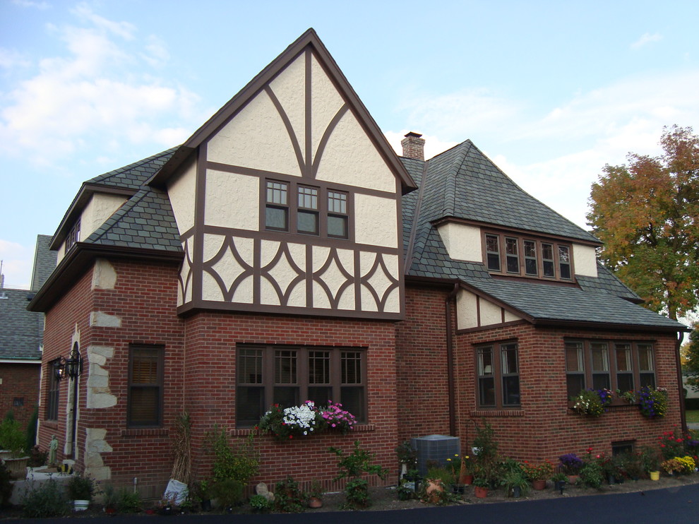 Photo of a medium sized traditional two floor brick house exterior in Chicago.