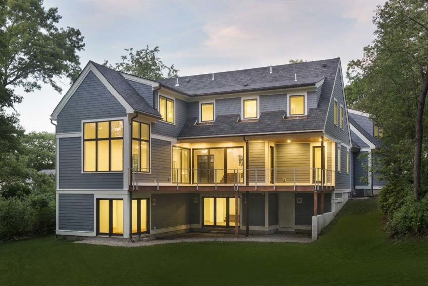 Inspiration for a large transitional blue two-story wood exterior home remodel in Boston