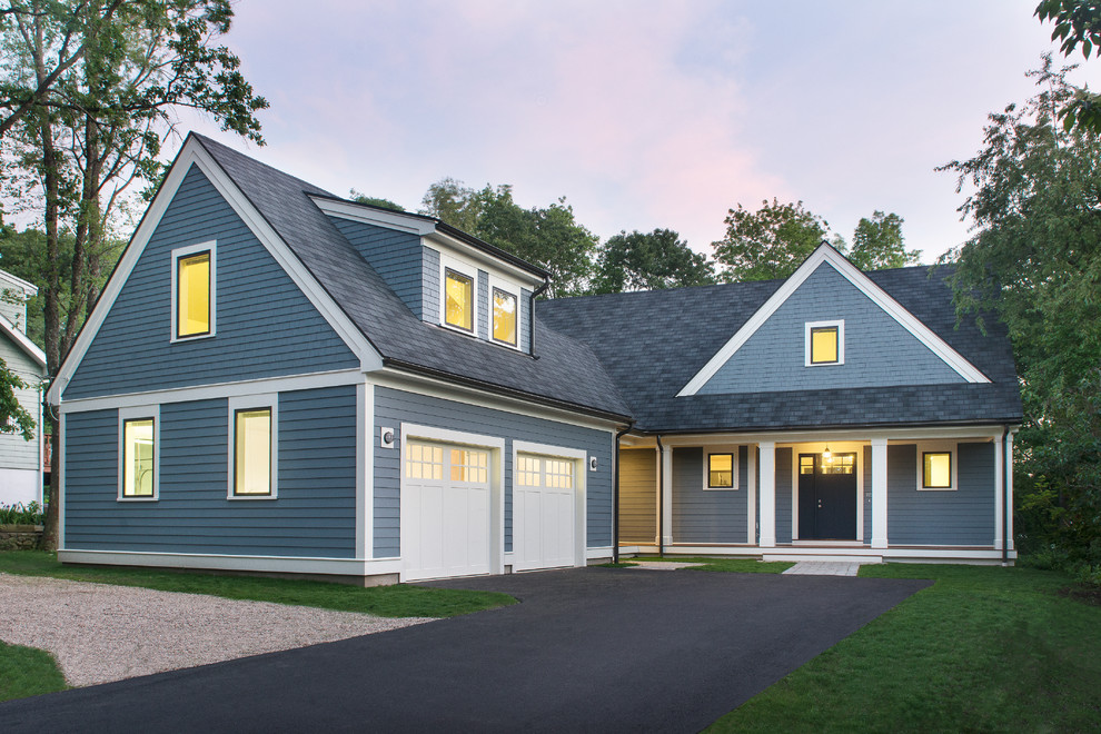 Example of a large transitional blue two-story wood exterior home design in Boston