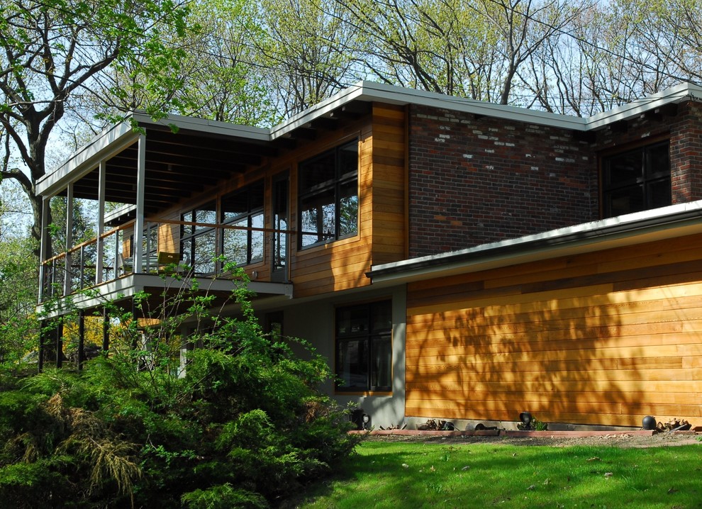 Photo of a modern house exterior in Boston with wood cladding.