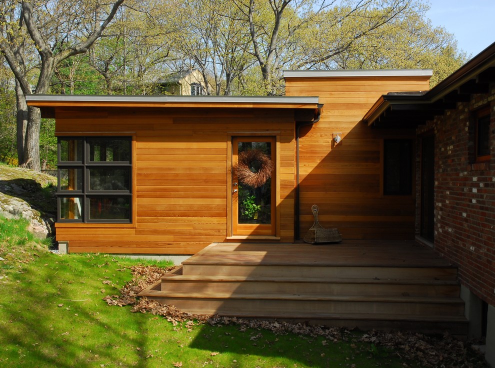 Example of a minimalist wood exterior home design in Boston
