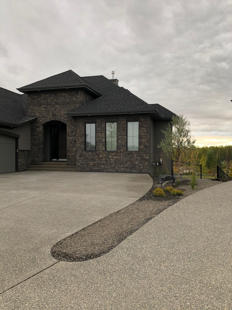 Example of a mid-sized trendy exterior home design in Calgary