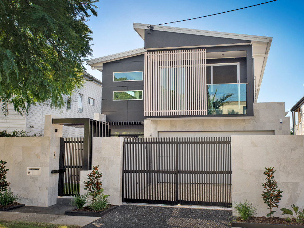 Example of a mid-sized minimalist gray two-story house exterior design in Brisbane