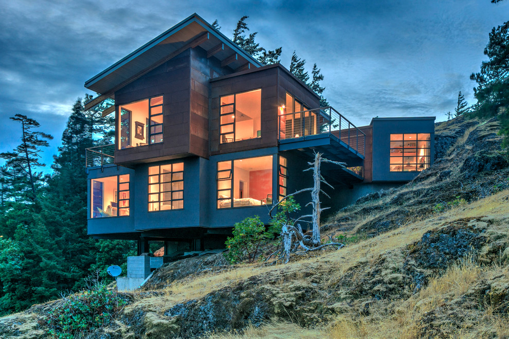 Inspiration for a mid-sized contemporary gray three-story mixed siding flat roof remodel in Vancouver