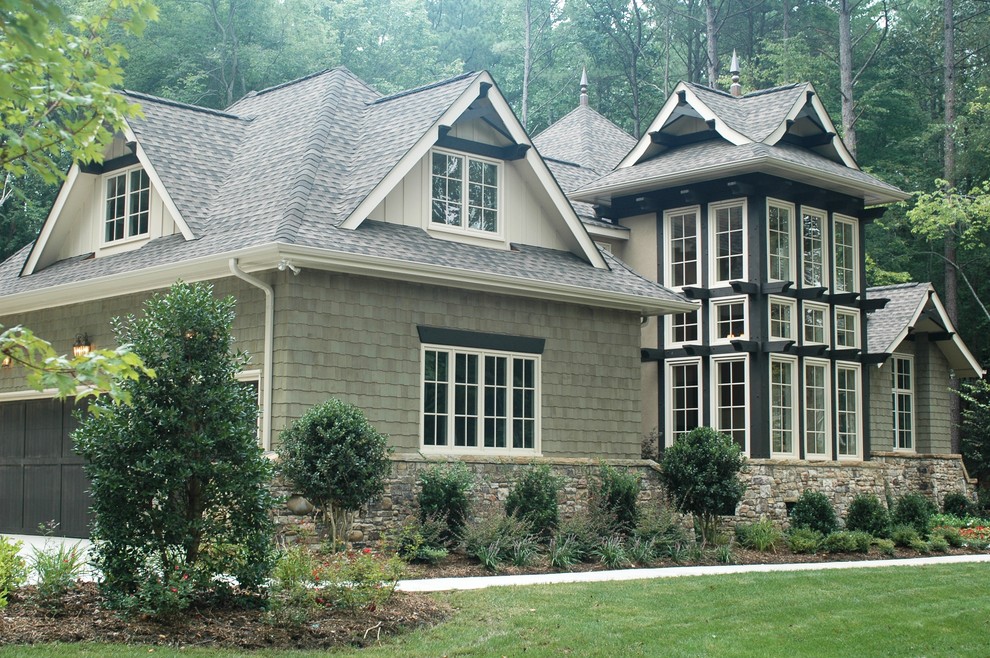 Inspiration for a large asian gray two-story wood gable roof remodel in Charlotte
