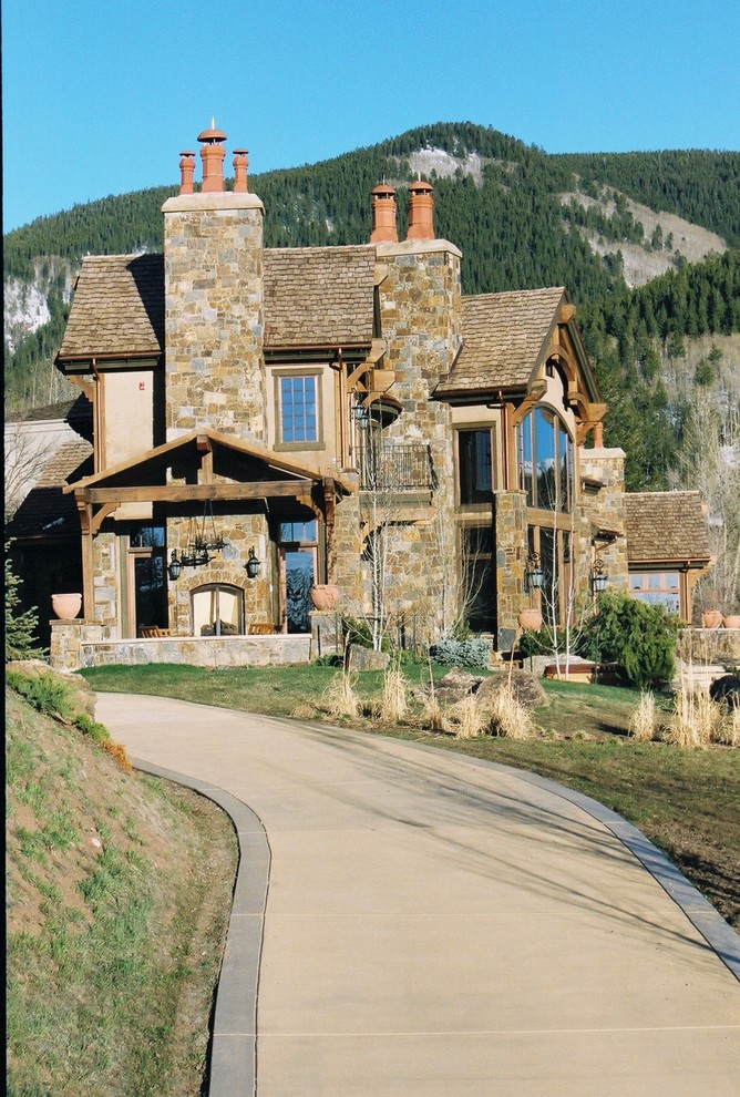 Huge rustic brown two-story mixed siding gable roof idea in Denver
