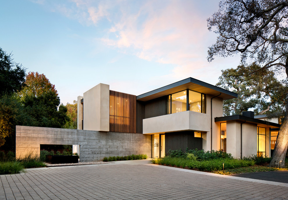 Inspiration för moderna flerfärgade hus, med blandad fasad och platt tak