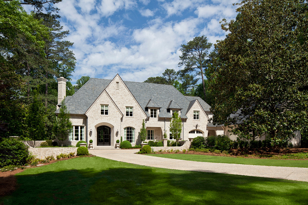 Example of a huge classic beige gable roof design in Atlanta